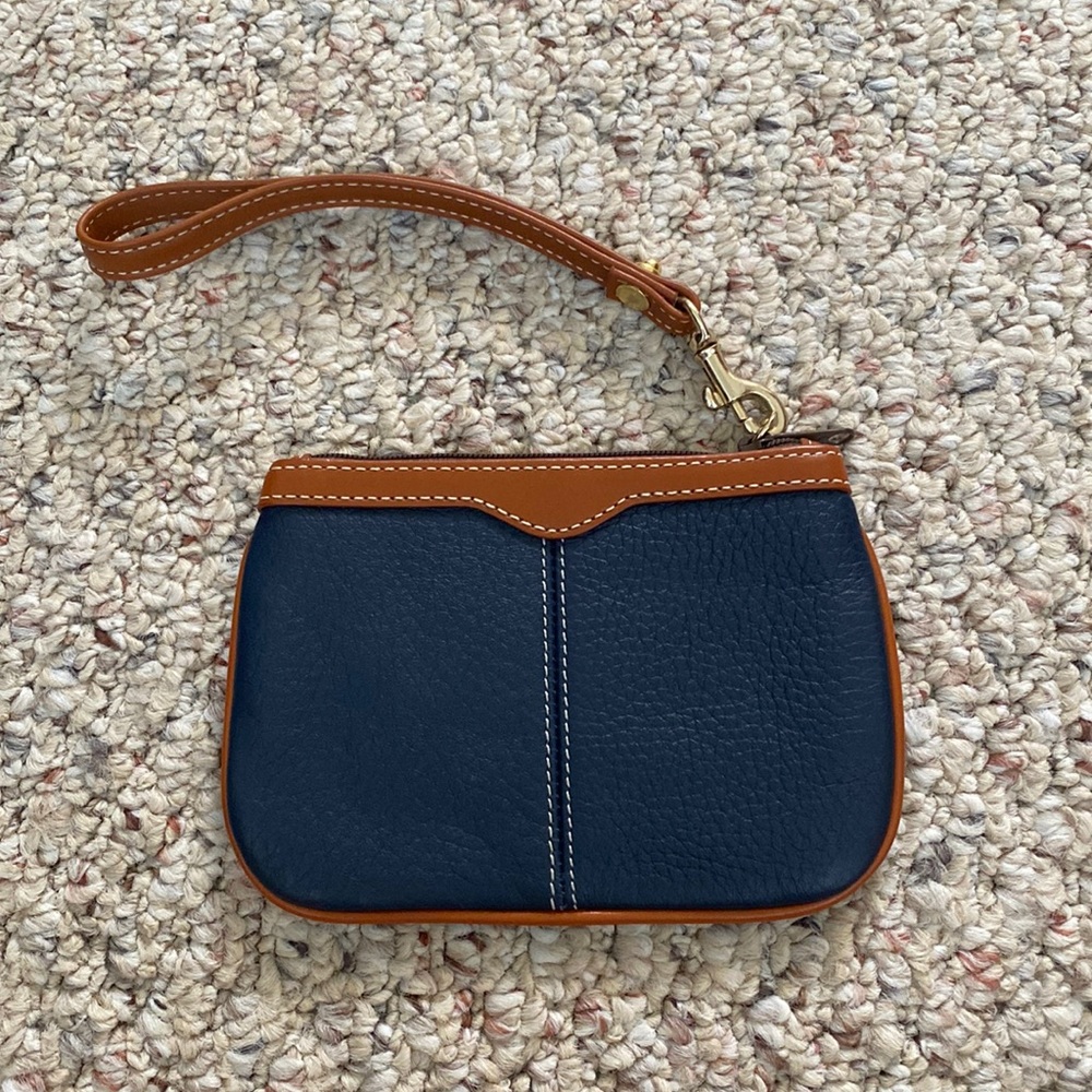 NWOT. Dooney and Bourke All Weather Leather wristlet.